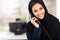 Muslim businesswoman phone