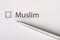 Muslim - checkbox with a cross on white paper with metal pen. Checklist concept