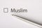 Muslim - checkbox with a cross on white paper with metal pen. Checklist concept