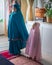 Muslim children praying at home. Learning to pray for the little girl. Happy and jovial child