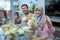 muslim couple asian making ketupat rice cake at home using palm leaf thumb up