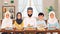 Muslim family gathering around dining table