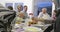 Muslim family praying before having iftar dinner together during a Ramadan feast at home