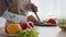 Muslim Female Cutting Vegetables Making Salad Cooking In Kitchen, Cropped