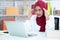 Muslim female employees stressed and tired with work, She is frustrated and is having a headache while sitting at a desk