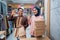 Muslim female and male preparing delivery parcel at the shop