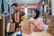 Muslim female and male preparing delivery parcel at the shop