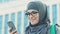 Muslim female tourist using navigator in phone, travel ban for islamic women