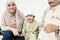 Muslim grandparents with their grandchild