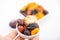 Muslim hand presenting collection of Ramadan dried fruits