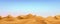 Muslim holiday banner concept. Realistic day time desert landscape with blue sky and clouds. Vector Greeting card for