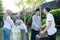 A Muslim husband, wife, and daughter shake hands with their family when they meet