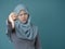 Muslim Lady Shows Thumbs Down Gesture, Disappointed Expression