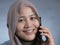 Muslim Lady Talking on Phone, Smiling Expression