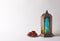 Muslim lamp with candle and dates