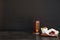 Muslim lantern Fanous and dried fruits on table against dark background