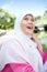 Muslim Malay woman smiling in an outdoor park
