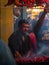 Muslim male vendor cooking selling halal foods and Kababs from roadside stall at night market in holy month of Ramadan . Vertical