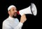 Muslim man with beard shouting through megaphone calling for Hajj