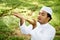 Muslim man praying outdoor. Nature landscape.Muslim man praying on green meadow.Muslim prayer,the light of faith, hope, faith.