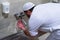 Muslim man taking ablution for prayer. Islamic Religious Rite Ceremony Of Ablution. Young Muslim man perform ablution wudhu