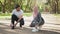 Muslim man and woman in hijab tying laces on sneakers. Happy arabian man and woman tying laces on sport sneakers