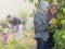 Muslim Mother and Daughter Harvesting Fruit at Home Garden