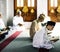 Muslim people reading Quran in mosque