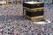 Muslim pilgrims revolving around the Kaaba in Mecca Saudi Arabia. Muslim people praying together at holy place.