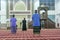 Muslim praying at a mosque at night