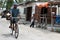 Muslim riding bike over dirt road fishing village