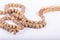 Muslim rosary prayer beads on white background