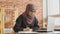 Muslim student working in behind a laptop. A young girl in a hijab working in the office