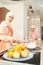 Muslim woman cooking food with friend in kitchen