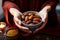 A Muslim woman gracefully holds a bowl of dates, breaking her fast traditionally