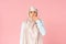 Muslim woman in hijab gesturing, isolated on pink