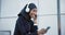 Muslim, woman and listening to music on headphones, phone or streaming radio, podcast or online audio. Happy, girl in