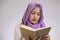 Muslim Woman Looks Tired and Sleepy when Learning or Reading Book