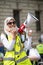 Muslim woman with megaphone at the counter-demo by pressure group Unite Against Fascism in Whitehall, London, UK.