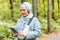 Muslim woman at the park using smartphone connected online wireless