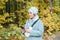 Muslim woman at the park using smartphone connected online wireless