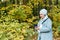 Muslim woman at the park using smartphone connected online wireless. Copy space