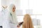 Muslim woman patient having consultation with female muslim doctor In clinic