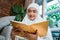Muslim woman reading al quran