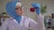 Muslim woman scientist chemist in national scarf working in the lab close up