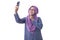 Muslim Woman Smiling and Taking Selfie Picture of Her Self on Phone