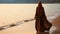 A Muslim woman in a veil or veil walks along the beach near the ocean.