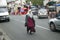 Muslim woman walking down street, Paris, France