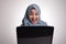 Muslim Woman Working on Laptop Shocked Stunned Excited Gesture