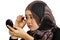 Muslim women applying makeup